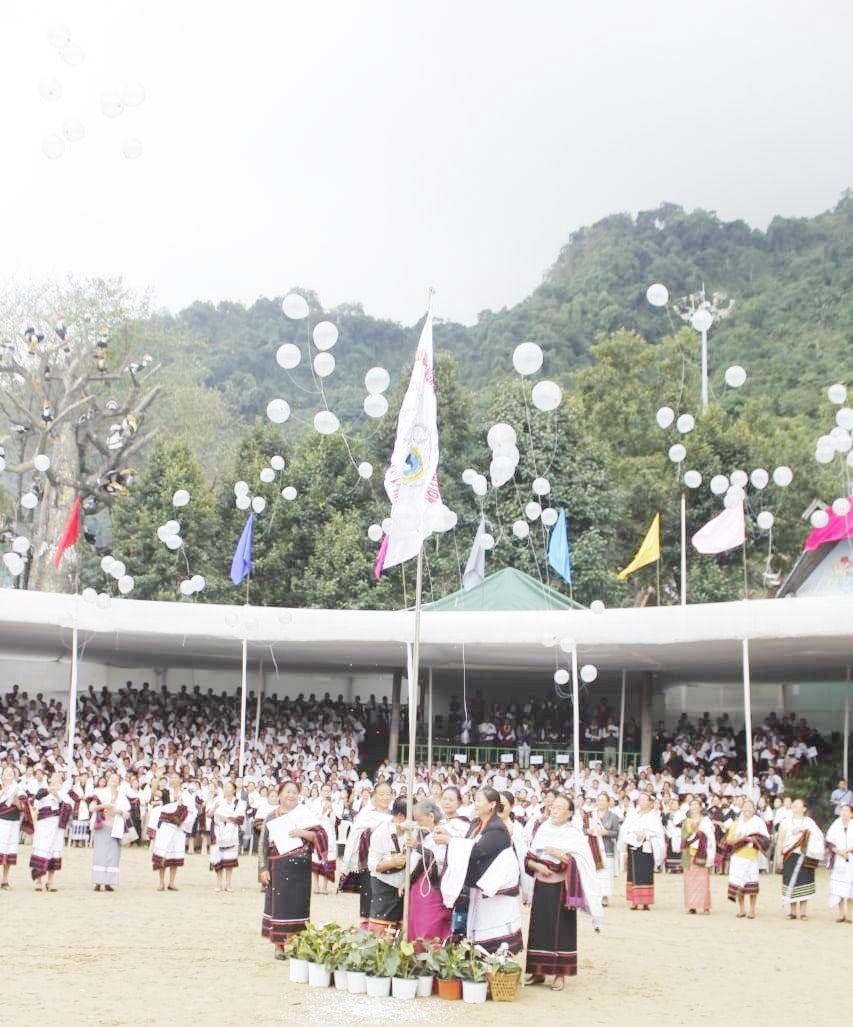 Neisevoü Kirha, SAWO Founding Leader hoisting the Jubilee Flag of the Southern Angami Women Organization Silver Jubilee at Naga Heritage Village, Kisama on October 13. (Morung Photo)